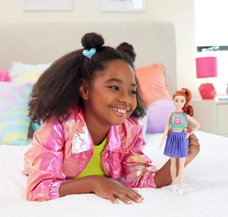 Barbie Fashionistas Doll #232 with Red Hair, Wearing Sporty “B” Jersey Top and Pleated Purple Skirt with Watch and Sneakers​​ - Image 1